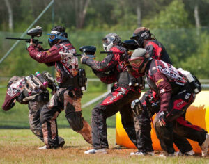 Paintball team members charging ahead