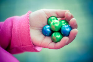 Paintballs in child's hand